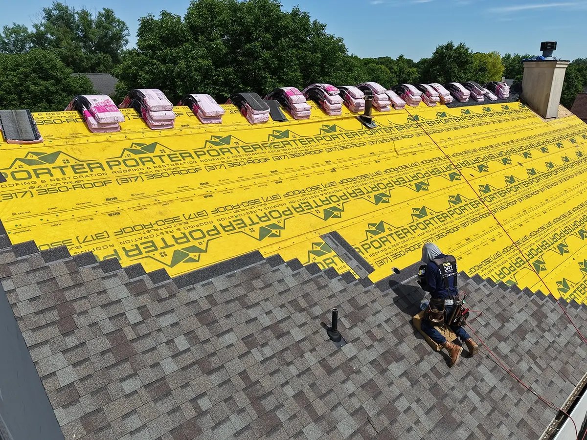 Porter Worker installing new roof