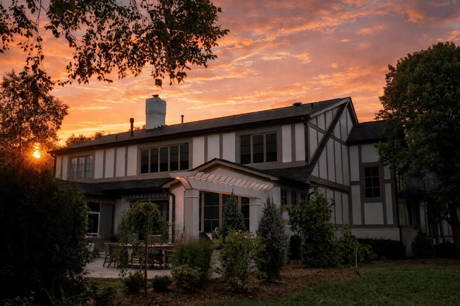 Tudor house at sunset in garden